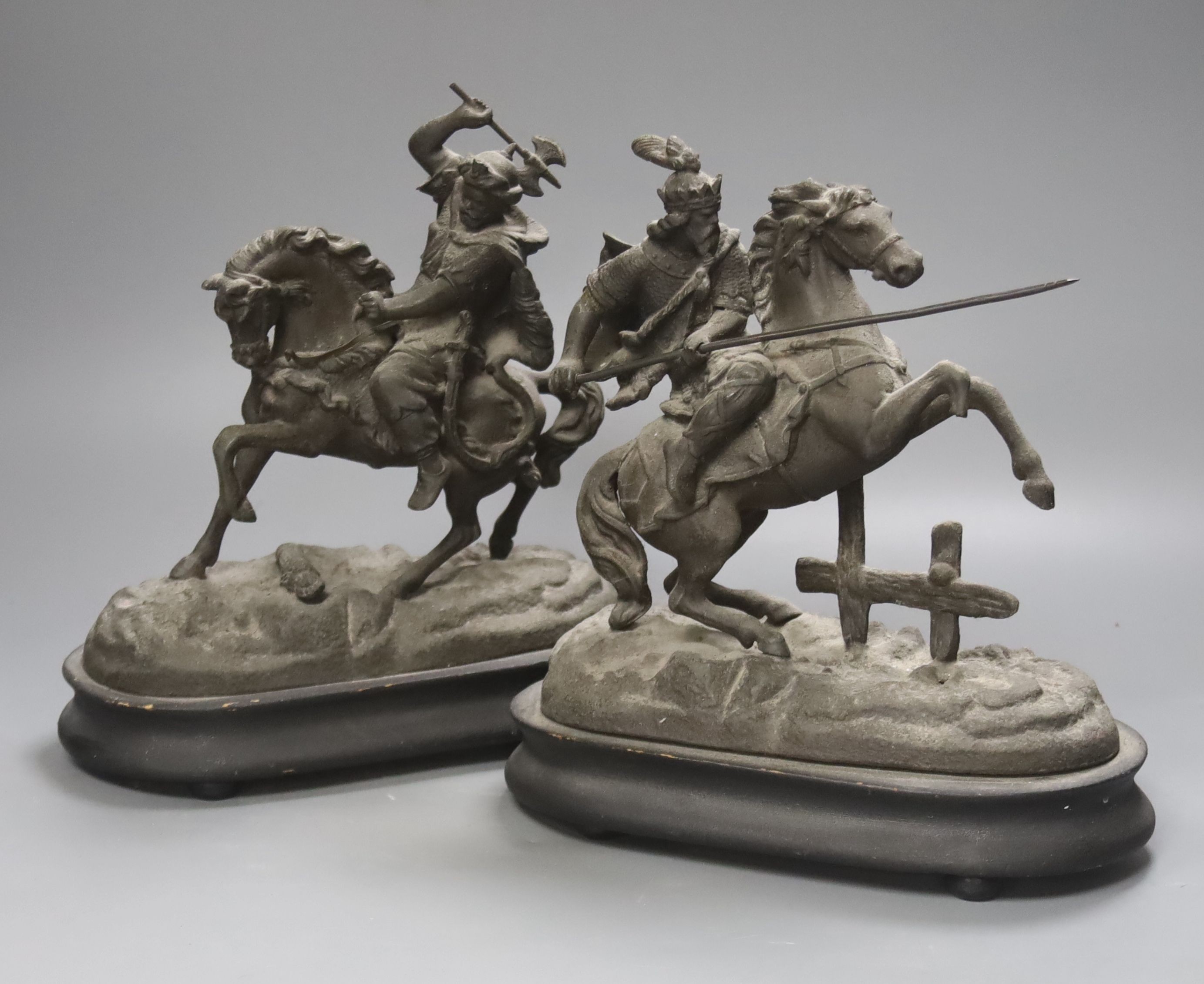 A pair of spelter figures on horseback